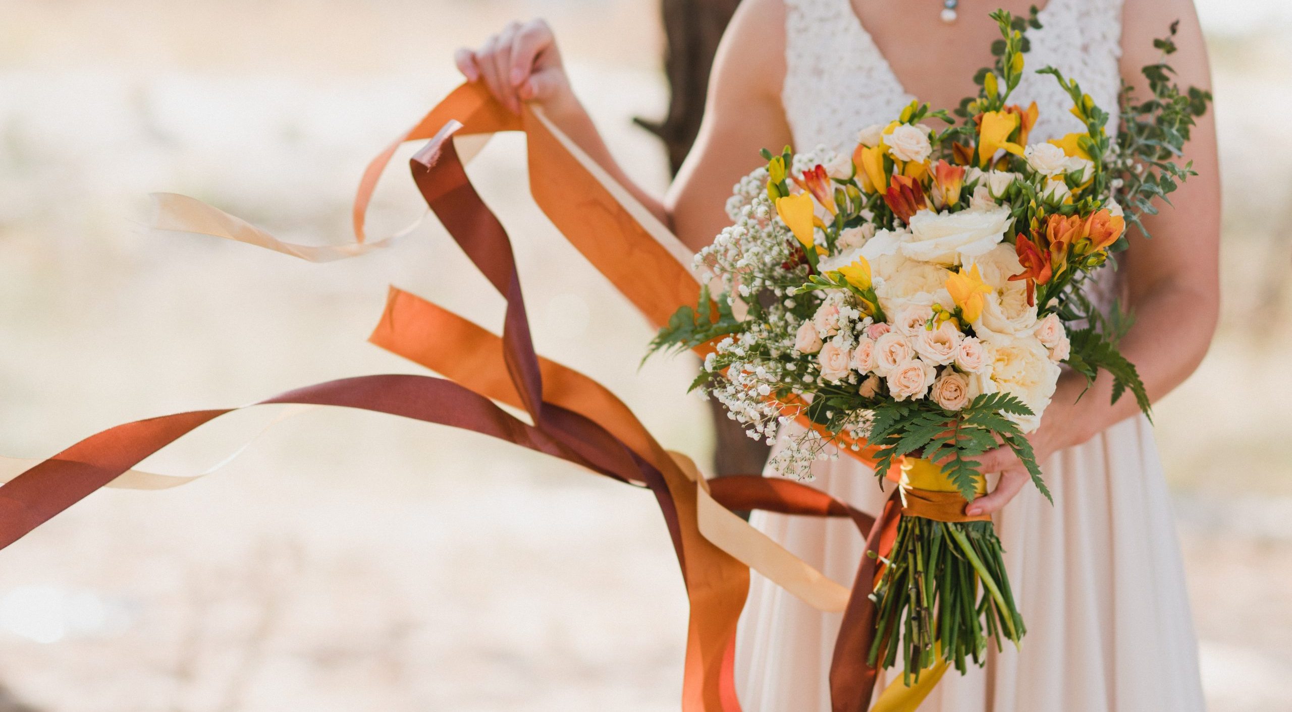 yellow and red bride bouquet