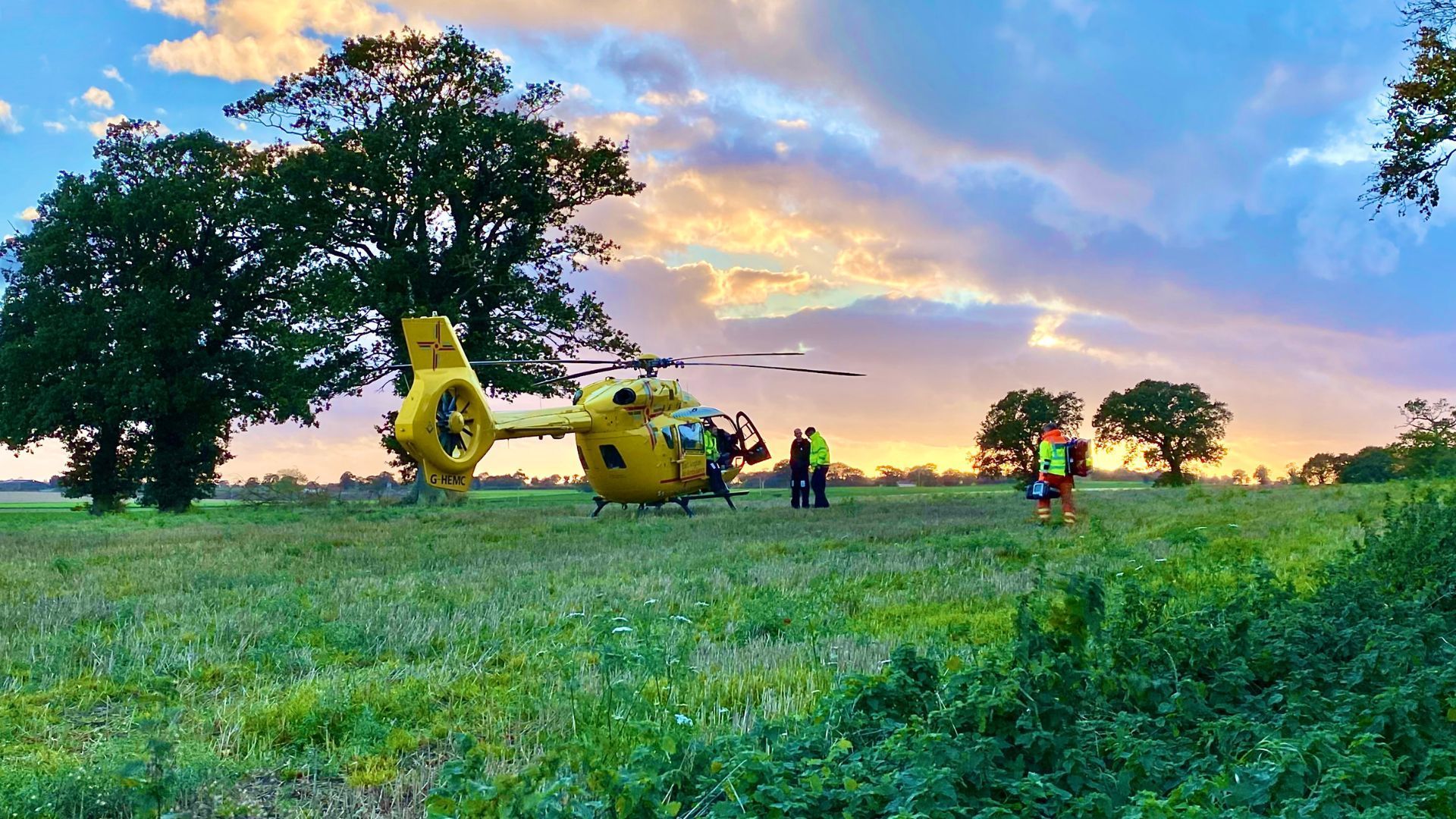 EAAA Helicopter in rural area with crew