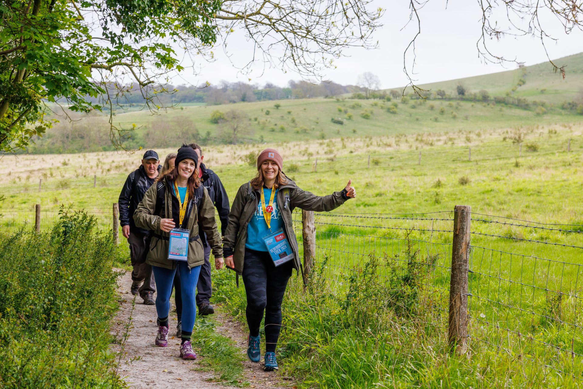 Trek Beds- Participants walking in a field