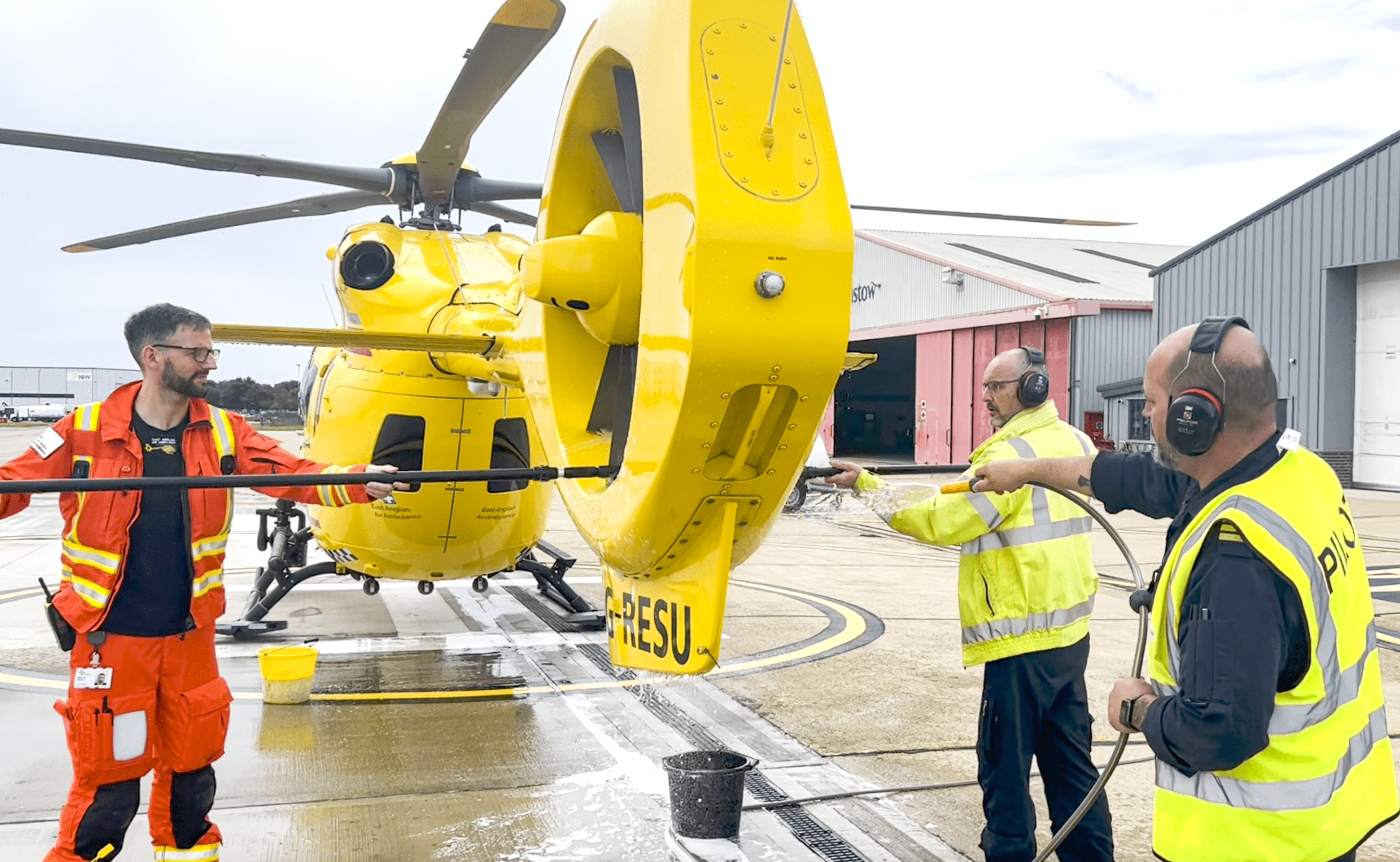 Crew washing helicopter for Trade Up Challenge